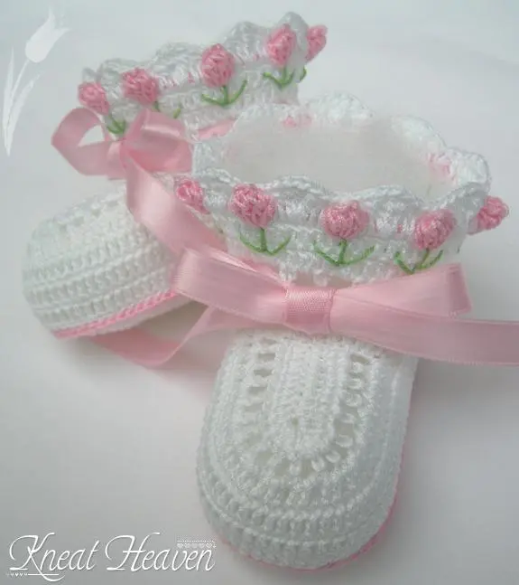 White crochet tulip baby booties with pink tulips and ribbon laces
